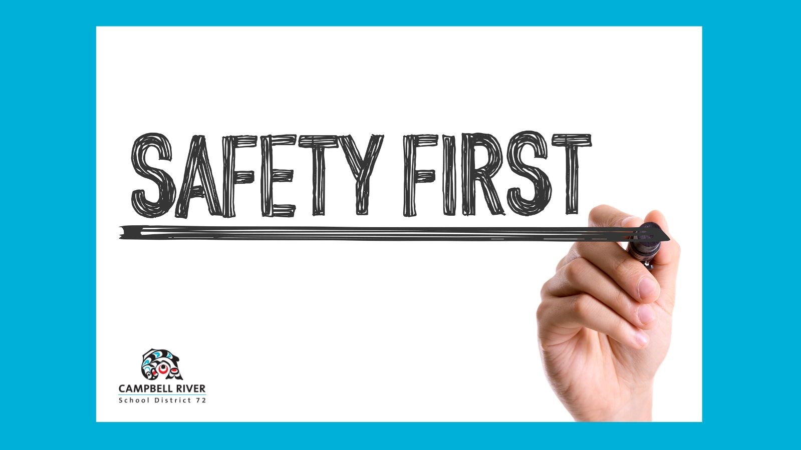 Hand writing 'Safety First' on a board.